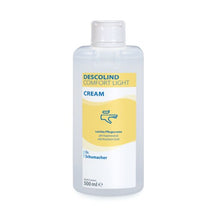 Eine 500 ml Dr. Schumacher GmbH DESCOLIND COMFORT LIGHT CREAM für empfindliche Haut, mit gelb-weißem Etikett und blauem Handcreme-Symbol.