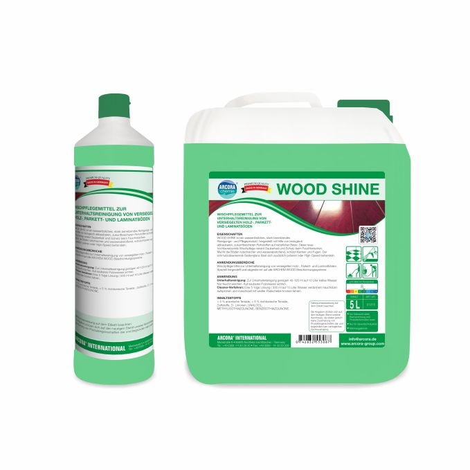 Pictured are two green-white Arcora WOOD SHINE containers from Arcora International GmbH: a 1-liter bottle and a 5-liter canister, both with German instructions for cleaning sealed wood, parquet, and laminate floors.