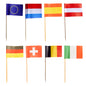 Fifty PAPSTAR decoration picks 8 cm "Nations" paper flags on wooden sticks (by PAPSTAR GmbH) are shown in two rows as stylish table decoration, featuring the countries EU, Netherlands, Spain, Austria, Germany, Switzerland, Belgium & Ireland. White background.