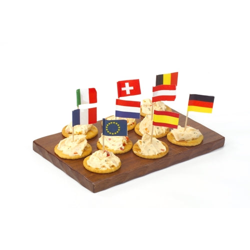 A wooden tray contains seven crackers, each with a spread and topped with PAPSTAR decoration picks 8 cm "Nations" (various countries & EU). Perfect as table decoration for celebrations and events. Brand: PAPSTAR GmbH.