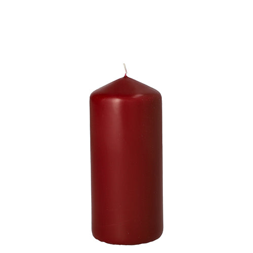 The Starpak pillar candle with extra long burning time (Ø 60 mm, 130 mm) stands unlit and upright against a white background – high quality from Starpak for long-lasting candlelight.