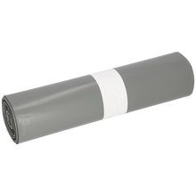 Eine Rolle der EMIL DEISS KG (GmbH + Co.) DEISS 14005 - 700x1100x0,06 mm grau Müllsäcke (25 Stück) mit weißem Papierband liegt auf weißem Hintergrund-perfekt für Verpackung und Versand dank robuster Folienrolle.