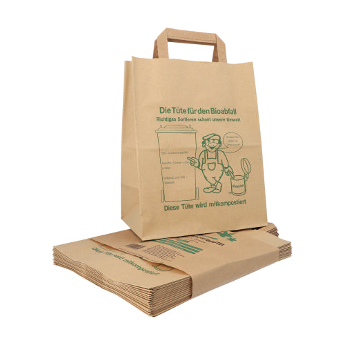 A stack of PAPSTAR paper compost bags with handles (28x22x14 cm, brown, 15 pieces), one upright. The bags show a green composting graphic and a German text about proper sorting of kitchen waste, as well as the image of a person with a bin.