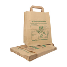 A stack of PAPSTAR paper compost bags with handles (28x22x14 cm, brown, 15 pieces), one upright. The bags show a green composting graphic and a German text about proper sorting of kitchen waste, as well as the image of a person with a bin.
