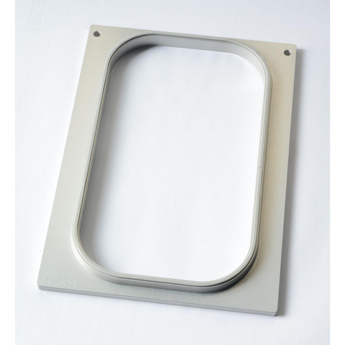 The Duni GmbH cassette DF10/20 is a rectangular metal frame with rounded corners and an oval cutout in the middle, measuring 265x161 mm and a depth of 60-100 mm, designed to accommodate PP 1/4 GN trays in the professional kitchen; it features two upper corner holes.