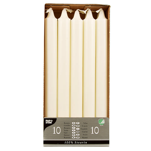 A pack of 10 PAPSTAR crown candles (Ø 2.2 cm, 24 cm, white, 100% stearin) stands upright in a cardboard tray with a partially transparent label at the bottom showing text and symbols. Brand: PAPSTAR GmbH.
