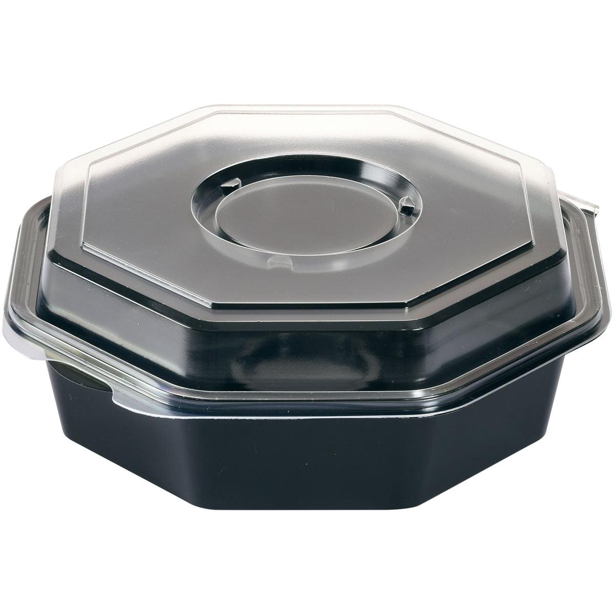 The Octaview® with Glass Black / Transparent PS food container by Duni GmbH is a black, octagonal plastic container with a clear, fitted lid, depicted tilted on a white background.