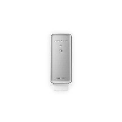 The CWS PureLine front panel for the surface cleaner toilet is a silver, wall-mounted dispenser with a visible push lever, minimal text instructions, and modern design, depicted against a white background.