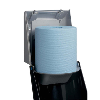 A blue paper towel roll is inserted into a gray Kimberly-Clark Professional™ wiper dispenser - central pull (1 dispenser, gray) by Kimberly-Clark GmbH, with the lid open for hygienic removal via the convenient central pull.