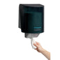 A hand pulls a towel from the Kimberly-Clark Professional™ wiper dispenser - central pull / gray by Kimberly-Clark GmbH, ensuring hygienic towel removal with each use.