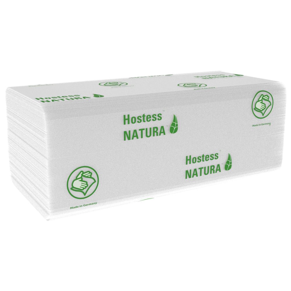 A stack of white, folded Hostess™ NATURA™ towels (Kimberly-Clark GmbH), large, 20 x 84 sheets, with green branding and thumbs-up symbol. Made in Germany - ideal paper towels for public areas. 20 packs per carton.