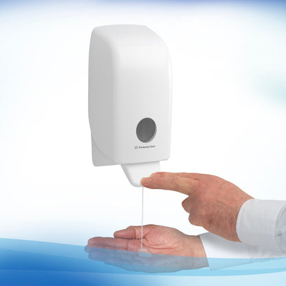 A person uses a Kimberly-Clark GmbH Scott® Anti Bac Foam Soap dispenser (1L transparent cassette, 6 per carton) with one hand and catches the antibacterial foam for effective hygiene in washrooms.
