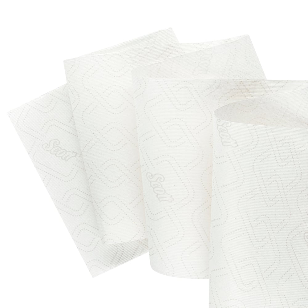 Three partially unrolled white Scott® Essential™ roll towels Slimrolls (1-ply, 6x180m) from Kimberly-Clark GmbH with a subtle embossed pattern and branding on a solid background provide reliable comfort.