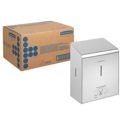 A box from Kimberly-Clark GmbH stands next to a Kimberly-Clark Professional™ stainless steel roll towel dispenser, with a slot on the front and an easy-to-understand guide below.