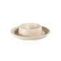 A beige, round, flat egg cup - uncoated brown bagasse Ø89 by Duni GmbH (pack of 70 pieces), with a raised center, is presented against a plain white background.