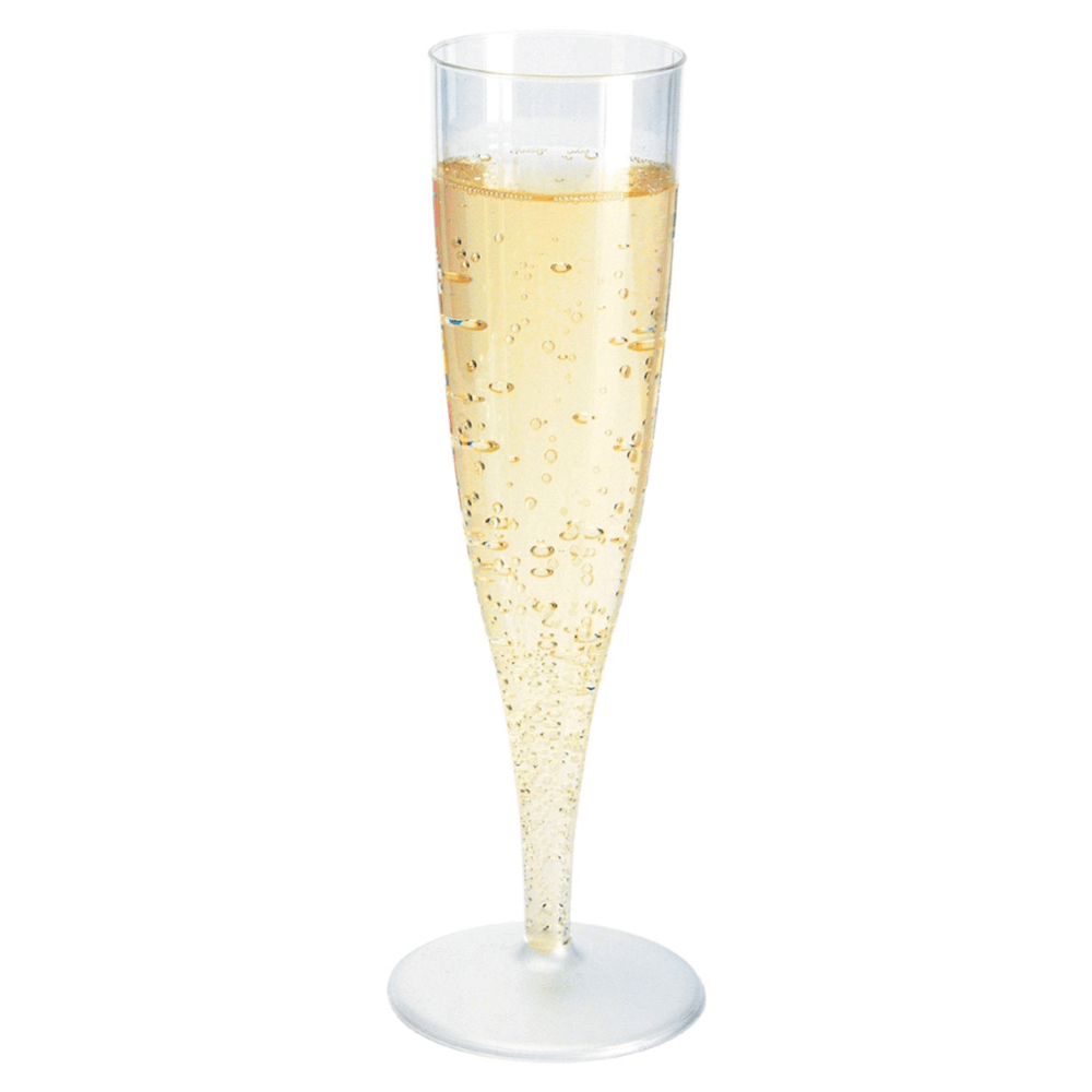 A tall, slender champagne glass packaged in a box, 135 ml Transparent by Duni GmbH, filled to the brim with sparkling champagne, whose visible bubbles gracefully rise to the surface. The glass stands elegantly against a simple white background, making it perfect for upscale events.