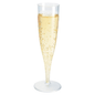 A tall, slender champagne glass packaged in a box, 135 ml Transparent by Duni GmbH, filled to the brim with sparkling champagne, whose visible bubbles gracefully rise to the surface. The glass stands elegantly against a simple white background, making it perfect for upscale events.