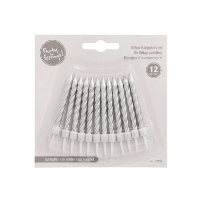 Pictured is a pack of 12 PAPSTAR birthday candles (6 cm) with holders from PAPSTAR GmbH in a plastic tray, labeled in multiple languages, against a light gray background.