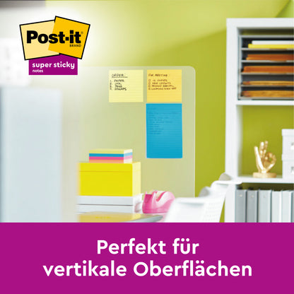 Ein Glastrenner mit gelben, orangen und blauen Post-it® Notes im Großformat (101 mm x 152 mm) der 3M Deutschland GmbH ist in einem Büro abgebildet. Der deutsche Text lautet: "Perfekt für vertikale Oberflächen." Es erscheint das Markenlogo.