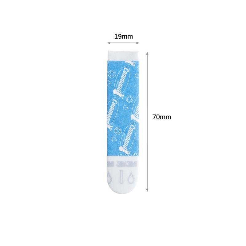 A blue and white rectangular Command™ Strip (Size M, 19mm x 70mm) from 3M Deutschland GmbH, with visible branding, symbols, and dimension arrow. The pack contains 10 pieces.