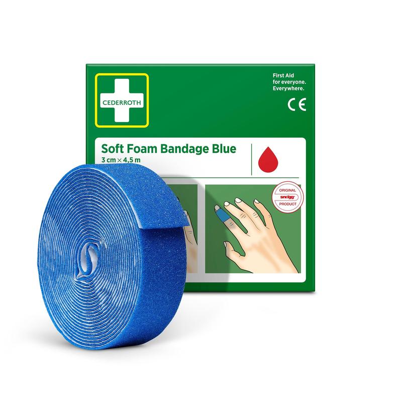 A roll of Cederroth Soft Foam Bandage blue 3x450cm from Orkla Wound Care AB is depicted in front of the green-white packaging, with the blue bandage wrapped around a finger.