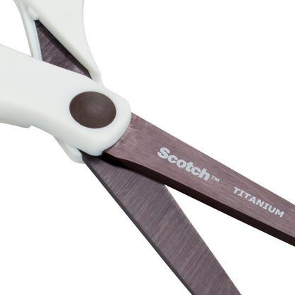 Close-up of a pair of Scotch™ titanium scissors (20 cm) from 3M Deutschland GmbH with white handles and titanium blades. "Scotch" and "Titanium" are printed in white on one blade.