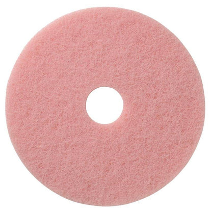 The pink, round TASKI Americo Remover Pad Kombipad for cleaning and polishing from Diversey Deutschland GmbH & Co. OHG has a rough texture and a hole in the middle, viewed from above on a white background.