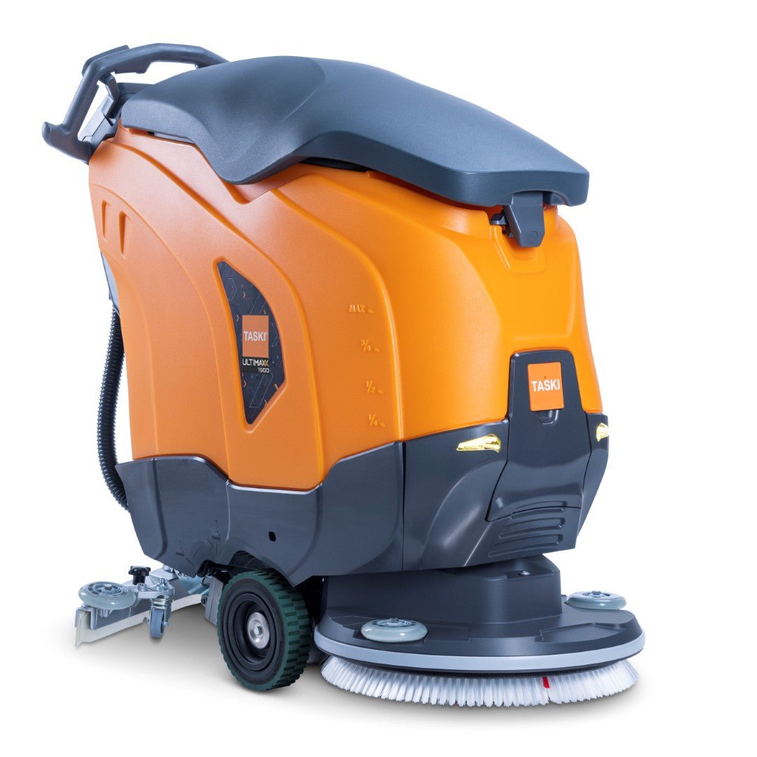 The orange-black industrial floor cleaning machine TASKI ULTIMAXX 1900 SD50 Performance BMS 25A from Diversey features a wheel drive, a rear handle, a 42-liter tank, a 50-cm single brush, and a side scrubbing/drying attachment - ideal for heavy cleaning tasks.