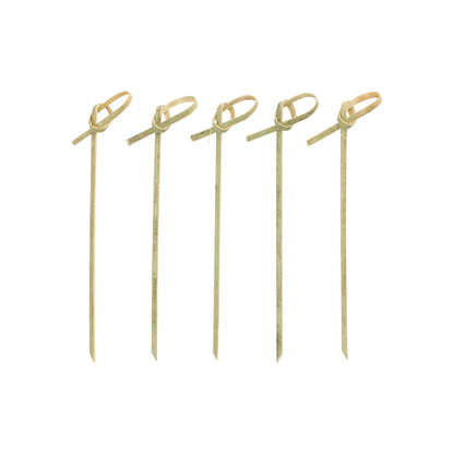 Five PAPSTAR 40 finger food picks "pure" from PAPSTAR GmbH, with knotted loops on the top, are arranged vertically in a row on a white surface.