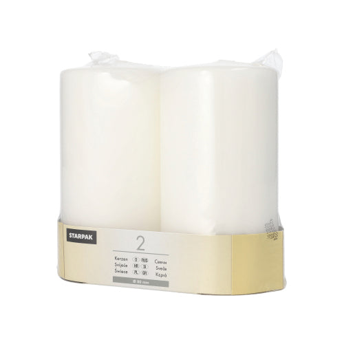 Two large white Starpak pillar candles (Ø 80 mm, flat top) are delivered in a 2-pack, packaged in clear plastic and provided with a beige-gray label at the bottom displaying product information and the brand name Starpak.
