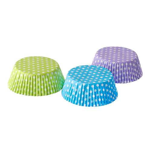 Three empty PAPSTAR 60 baking cups Ø 5 cm · 2.5 cm cupcake molds from PAPSTAR GmbH in green, blue, and purple polka dot design are arranged side by side on a white background - ideal for muffins or cupcakes at any celebration.
