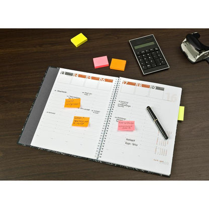 An open planner with handwritten notes and colorful Post-it® Notes Various Neon Colors (38 mm x 51 mm, 100 sheets/pad, 3 pads/pack, 100% PEFC) from 3M Deutschland GmbH on a wooden table with pen, calculator, and tape dispenser.
