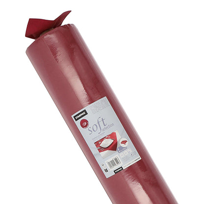 Eine große Rolle Starpak-Tischdecke, stoffähnlich Vlies „Soft Selection“, ist auf dem Etikett mit einem Strichcode, dem Markennamen Starpak und einem Bild der verwendeten Tischdecke versehen.