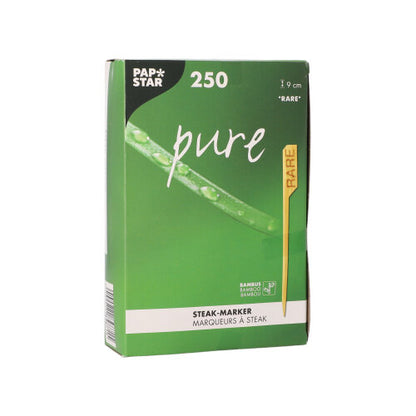 The PAPSTAR 250 steak marker 9 cm from PAPSTAR GmbH is delivered in a green-white box. The packaging contains a yellow "RARE" marker as well as leaf and water drop graphics, designed for professional restaurant kitchens.