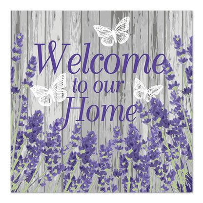 Sign with violet text "Welcome to our Home" on gray wooden background, decorated with lavender flowers and three white butterflies, in reference to PAPSTAR 20 napkins, 33x33cm, 3-ply by PAPSTAR GmbH.