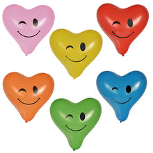 Die sechs PAPSTAR Luftballons "Heart - Blinky" (Ø 28 cm, bunt sortiert) der PAPSTAR GmbH sind in zwei Dreierreihen angeordnet und zeigen jeweils ein augenzwinkerndes Smiley-Gesicht in den Farben Pink, Gelb, Rot, Orange, Grün und Blau.