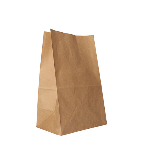 A PAPSTAR 250 block bottom bag made of brown kraft paper from PAPSTAR GmbH stands upright with slightly inclined sides and an open edge on a white background - an environmentally friendly choice for everyday life.