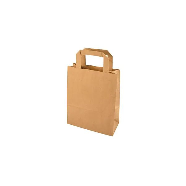 A PAPSTAR 50 carrier bag, paper with handle from PAPSTAR GmbH stands upright against a white background, featuring a flat rectangular handle and an eco-friendly paper design.