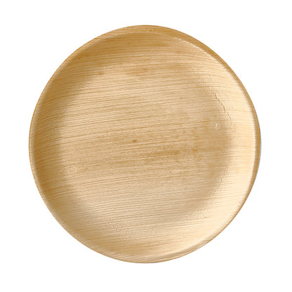 The PAPSTAR 25 plates "pure" round from PAPSTAR GmbH is a round, light brown palm leaf disposable tableware with a smooth surface and natural grain - biodegradable, environmentally friendly, and ideal for sustainable occasions.