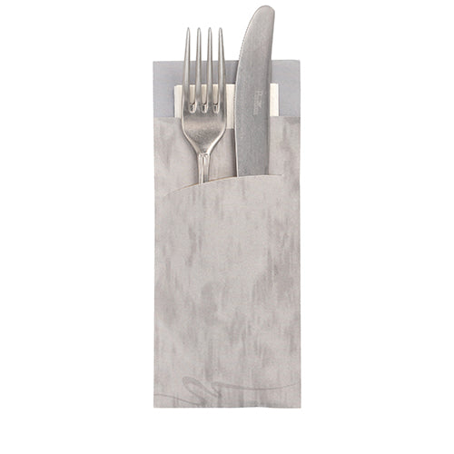 A silver fork and knife rest in a PAPSTAR 520 cutlery bag (20x8.5cm, 2-ply) with an integrated matching napkin from PAPSTAR GmbH, handles protrude and the napkin is partially visible behind.