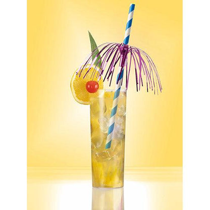 A tall glass with a chilled yellow drink with an orange slice, a cherry, a green leaf, a purple umbrella, and a blue-white PAPSTAR 50 straws paper (Ø 6 mm · 20 cm from PAPSTAR GmbH) on a yellow background.