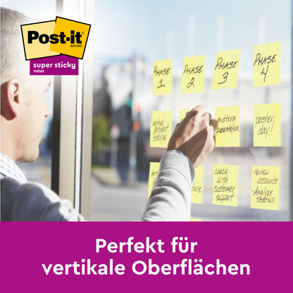 A person organizes the tasks "Phase 1" to "Phase 4" on a glass wall with Post-it® Super Sticky 100% Recycling Notes, 76x76mm, 70 sheets/block, 100% PEFC from 3M Deutschland GmbH. Text below: "Perfect for vertical surfaces.