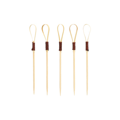 Forty PAPSTAR finger food picks 10 cm "Loop" cocktail picks from PAPSTAR GmbH, ideal for snacks and finger food, feature a unique loop design with dark brown wrapped sections arranged upright against a plain white background.