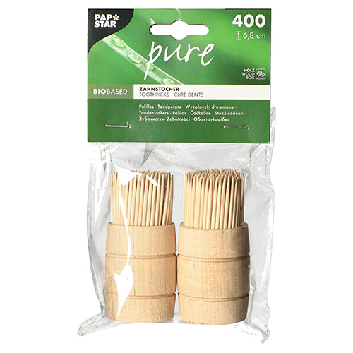 A transparent plastic packaging with two bundles of PAPSTAR wooden toothpicks "pure", round, 6.8 cm; contains 400 pieces in a wooden dispenser. Brand: PAPSTAR GmbH - Ideal as a practical and bio-based toothpick solution.