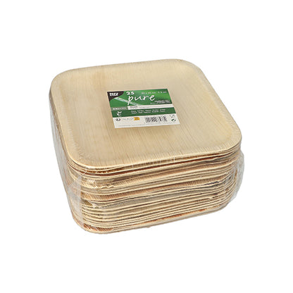 A stack of PAPSTAR 25 plates, palm leaf "pure" from PAPSTAR GmbH is wrapped in foil, with a green-white product label attached to the top plate.