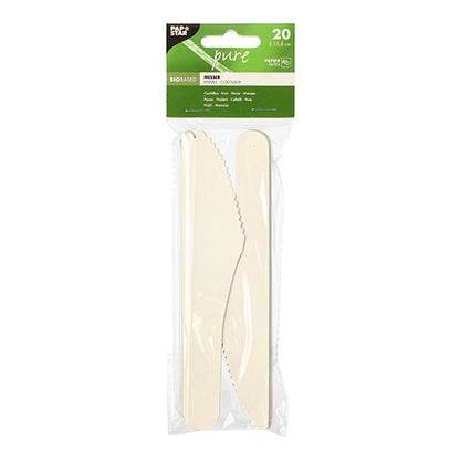 A transparent plastic package with 20 white PAPSTAR paper knives "pure", each 15.8 cm, eco-friendly and biodegradable, by PAPSTAR GmbH. The top label indicates the product name, size, eco-friendly feature, and quantity.