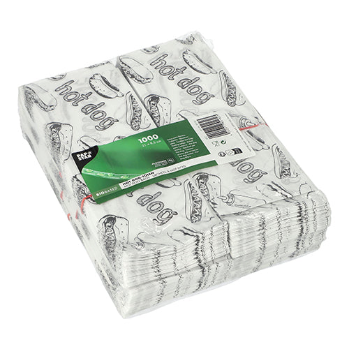 Eine Packung mit 1.000 PAPSTAR Hot Dog-Tüten (21 x 8,5 cm, weiß) mit schwarzem Hot Dog-Aufdruck, „Hot Dog“-Schriftzug und grün-weißem Oberetikett der PAPSTAR GmbH. Die Lieferung erfolgt hygienisch eingeschweißt in Schrumpffolie.