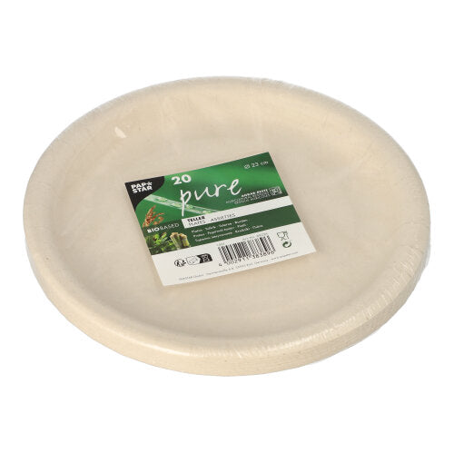 A stack of 20 round, beige PAPSTAR 20 plates made from agricultural residues "pure" by PAPSTAR GmbH, wrapped in foil and provided with a green-black label on the top showing product information and barcodes.
