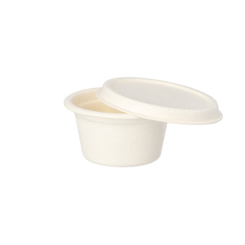 Depicted is a small, round, white PAPSTAR dressing bowl made of sugarcane disposable container (6 cm, 50 pieces) from PAPSTAR GmbH with matching lid against a simple white background.