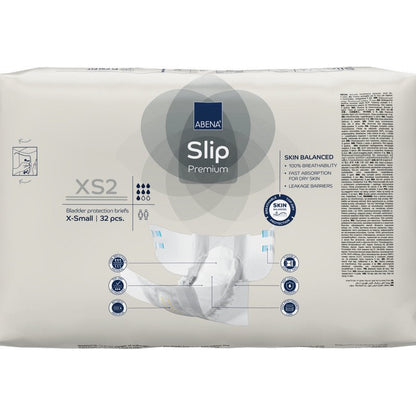A sealed pack of ABENA Slip Premium from Abena Re-Seller GmbH, size X-Small, contains 32 slips. The front displays key features and a diagram, making it ideal for effective incontinence care.